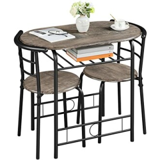 Compact dining set with table and two chairs, featuring a wooden tabletop and metal frame.