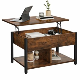 Rustic lift-top coffee table with storage compartments, laptop, and decor.