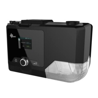 Black CPAP machine with digital display and water chamber.