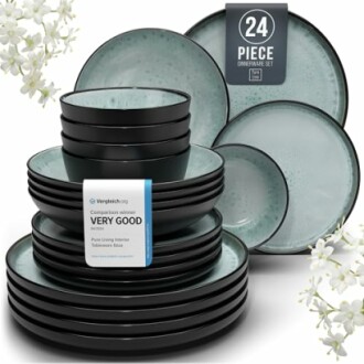 24-piece black and turquoise dinnerware set with plates and bowls.