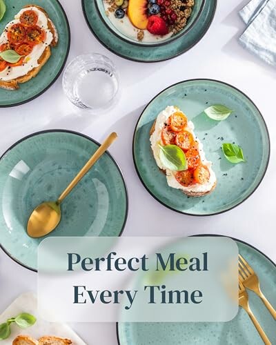 Colorful brunch plates with toast, tomatoes, berries, and a gold spoon.