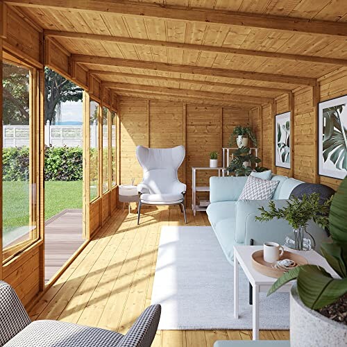 Wooden garden room with large windows, armchair, sofa, and plants.