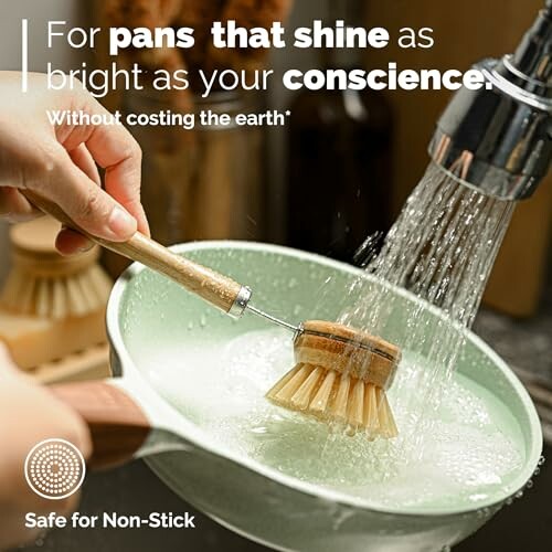Eco-friendly dish brush cleaning a pan under running water.