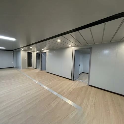 Modern interior of an office space with sleek design and wood flooring.