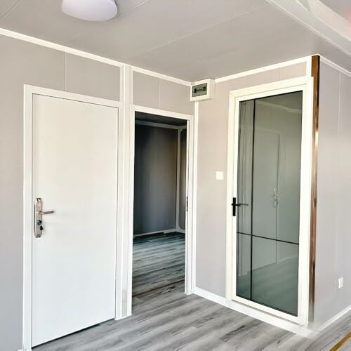 Modern interior with white doors and sleek flooring.