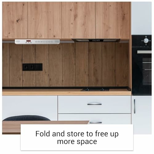 Modern kitchen with wooden cabinets and built-in appliances.