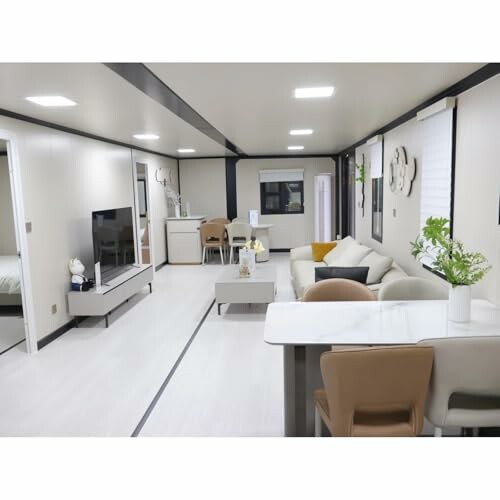 Modern minimalist living room with neutral tones and sleek furniture.