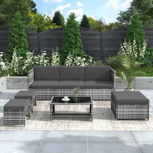 Contemporary outdoor patio furniture set with gray cushions.