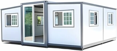Modern prefab modular building with multiple windows and sliding glass door.