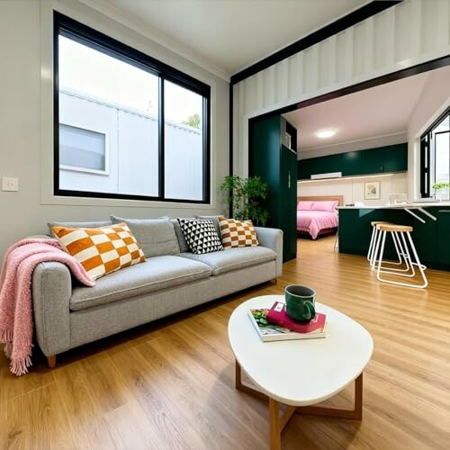 Modern studio apartment with a cozy living area and kitchen.