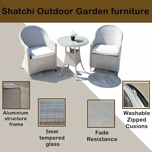 Outdoor garden furniture set with two chairs, a table, and cushions.