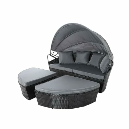 Outdoor wicker daybed with canopy and cushions