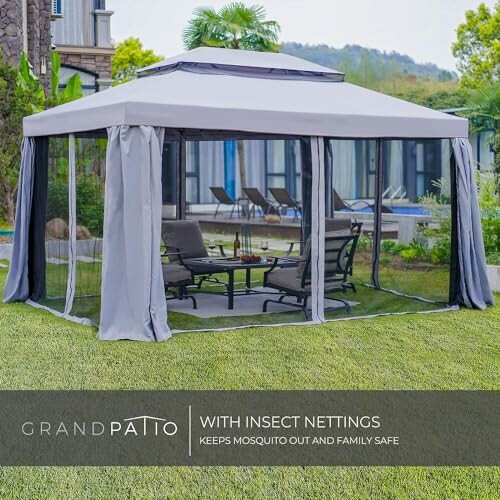 Outdoor patio gazebo with insect netting and chairs.