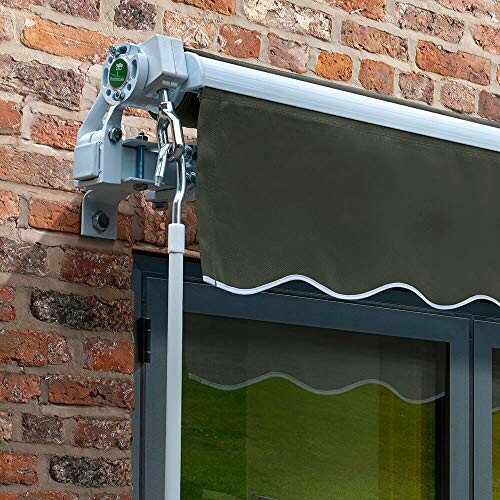 Retractable awning mounted on a brick wall above a window.