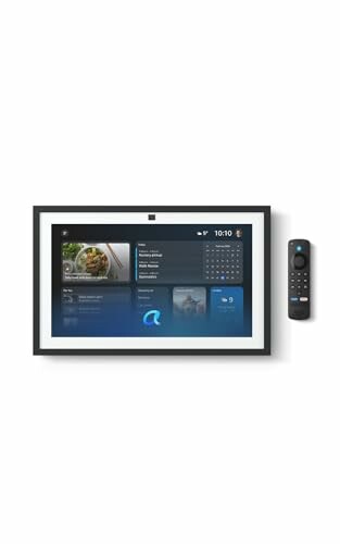 Smart display on wall with remote control beside it.