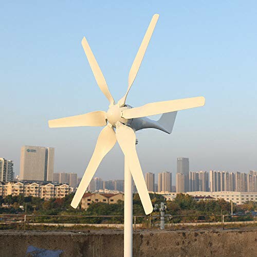 Small wind turbine installed on a rooftop with a city skyline in the background