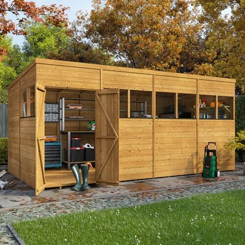 Large wooden garden shed with open door and tools inside.